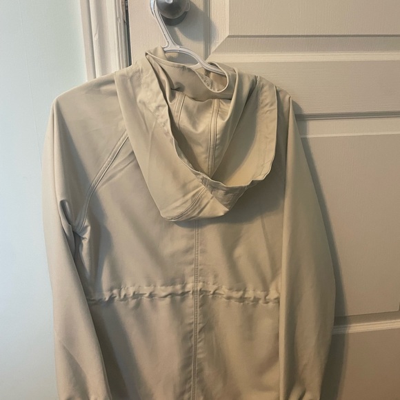 cream rain jacket. super cute! from costco. never worn - Picture 2 of 2